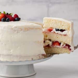 Slice of chantilly cake being taken out.