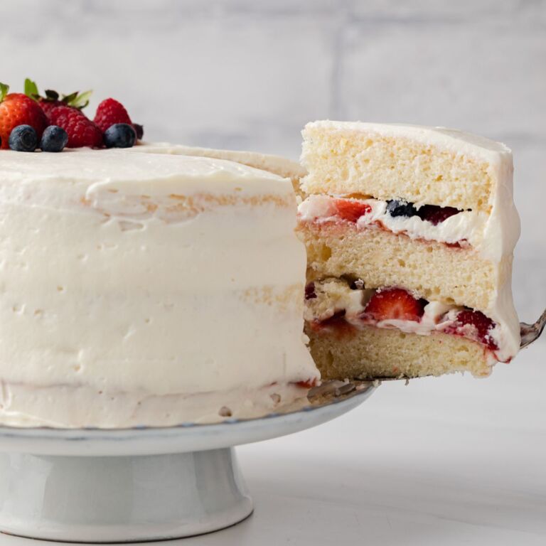 Slice of chantilly cake being taken out.