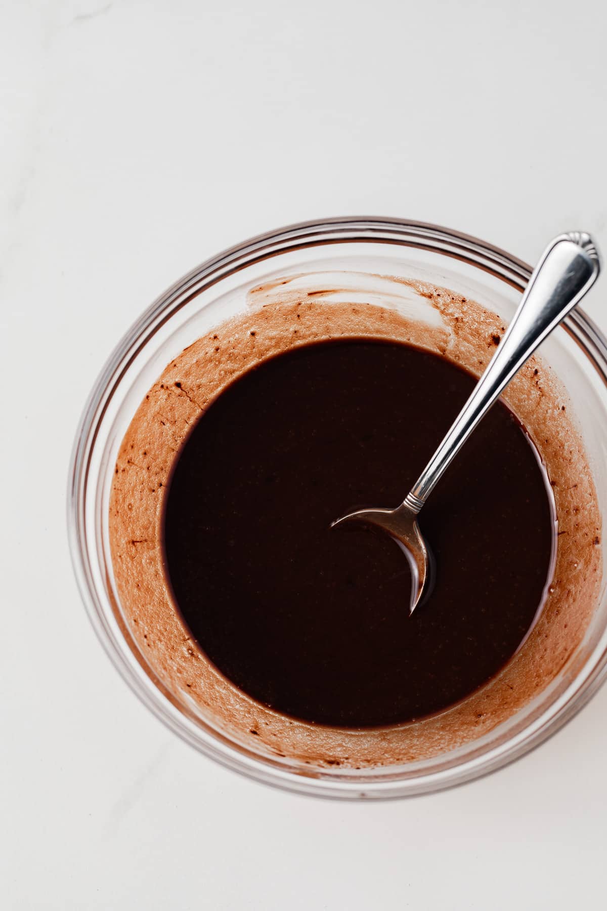 Melted chocolate and butter in glass bowl.