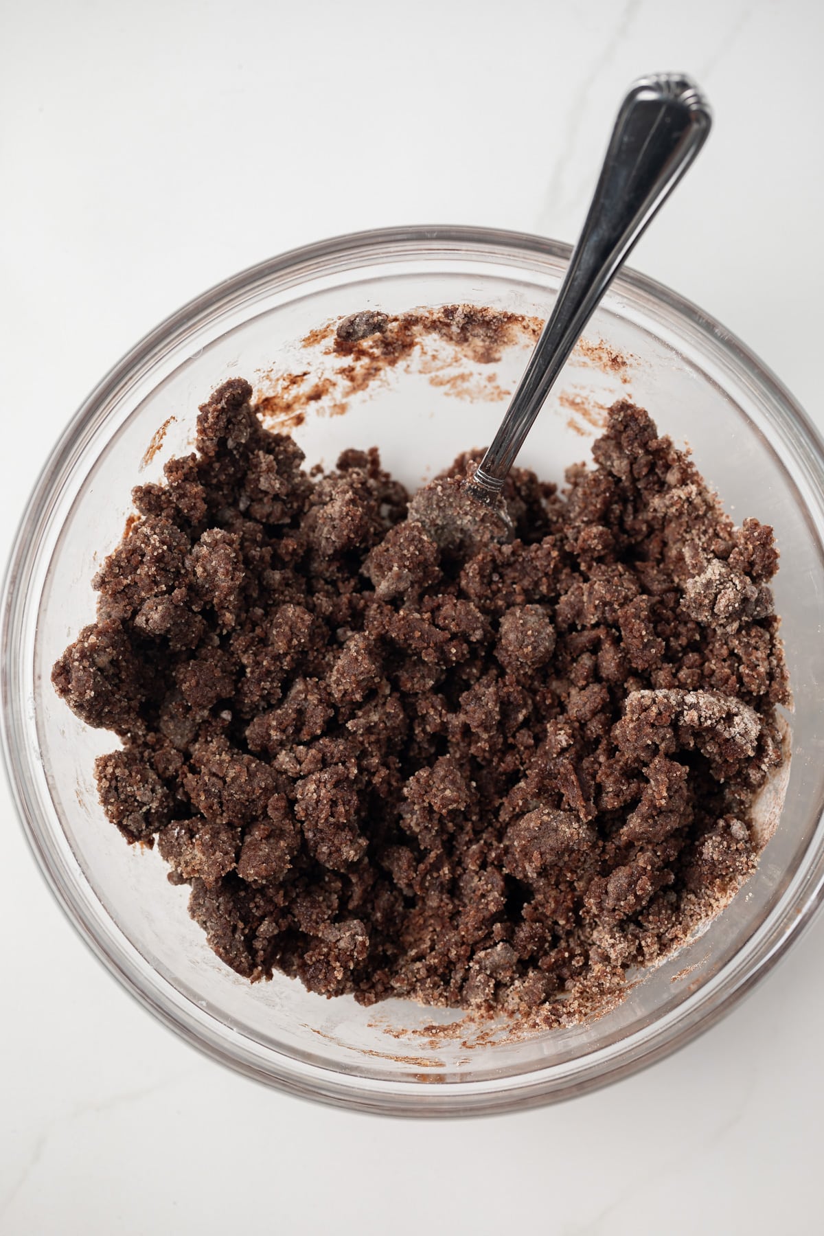 Chocolate dough in glass bowl.