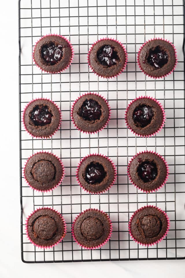 Chocolate cupcakes filled with cherry jam.