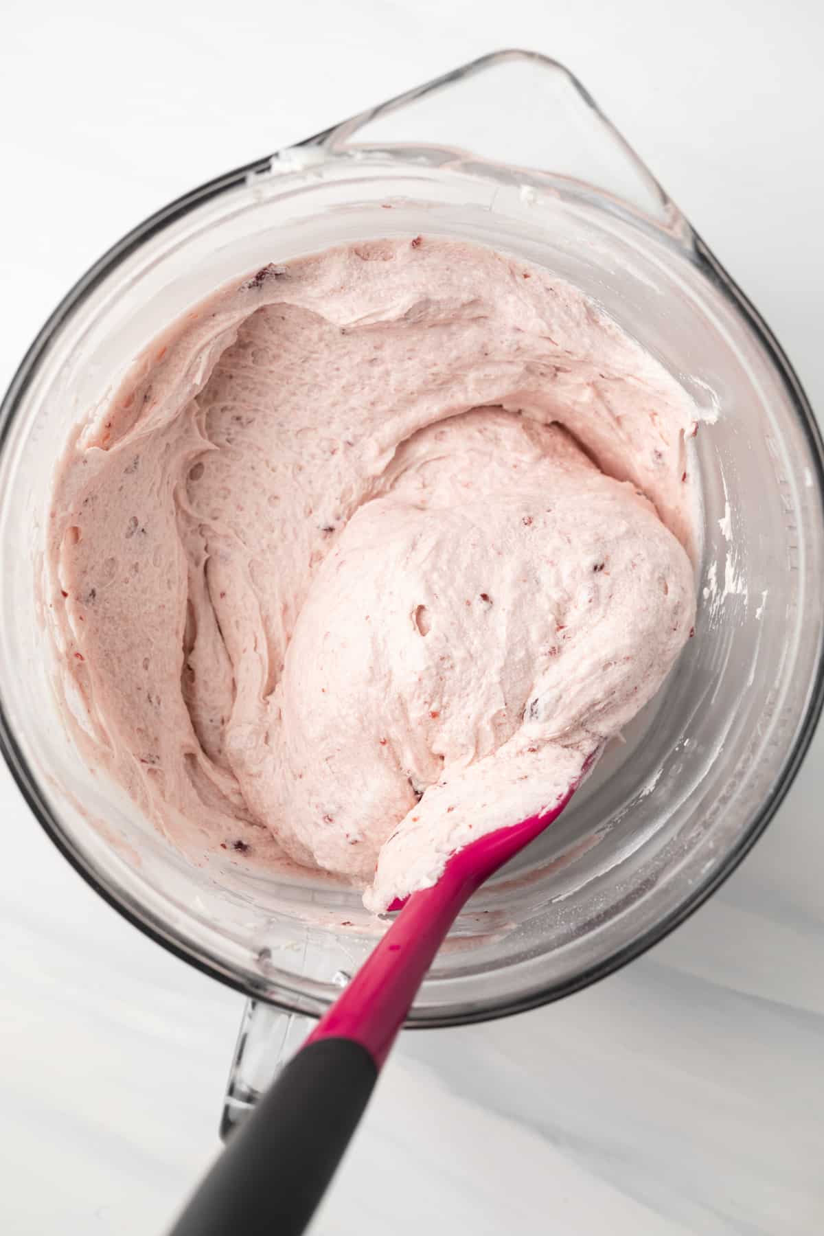 Cherry frosting in glass bowl.