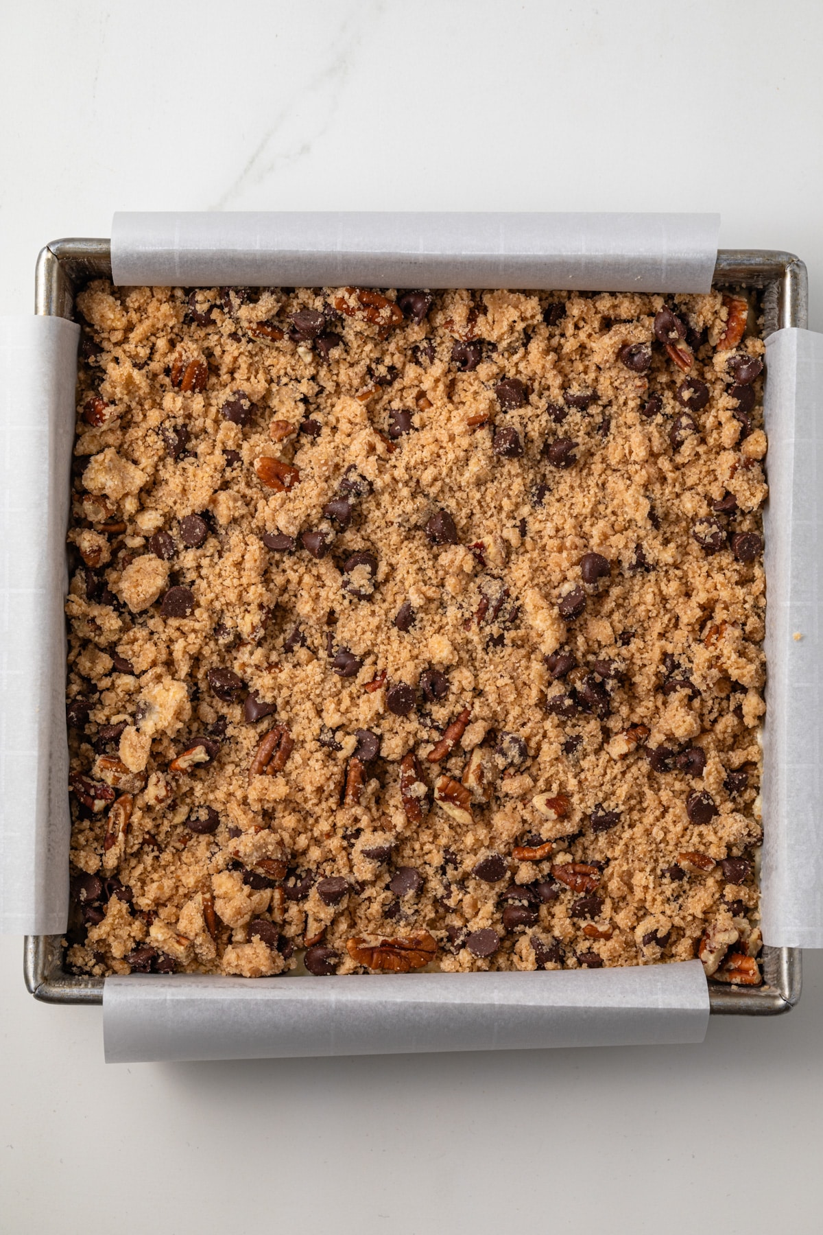 Unbaked coffee cake in a pan.