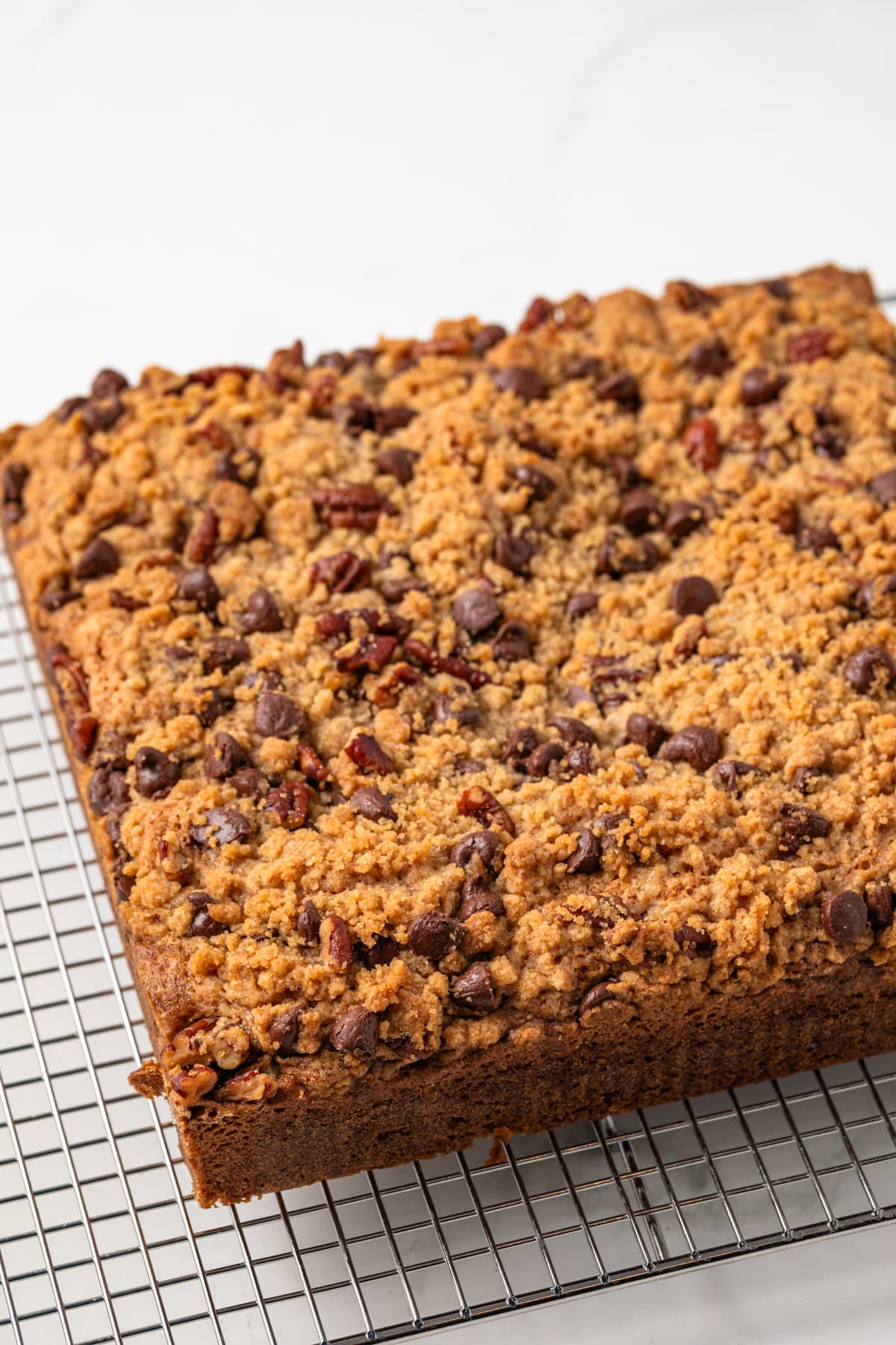 Coffee cake on a wire rack.