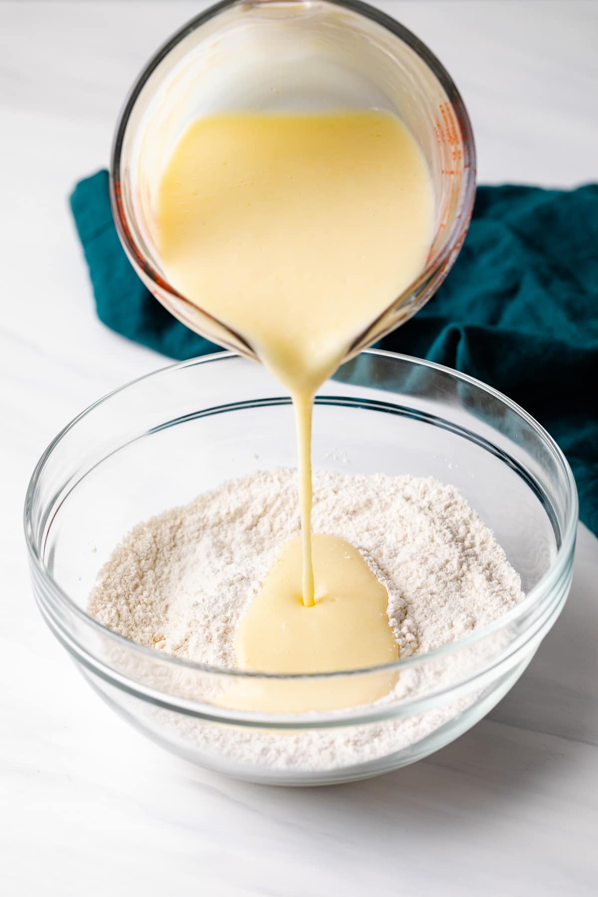 adding wet ingredients to dry ingredients