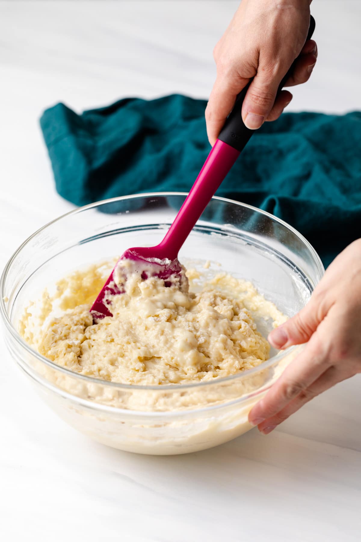 lumpy muffin batter mixed with spatula