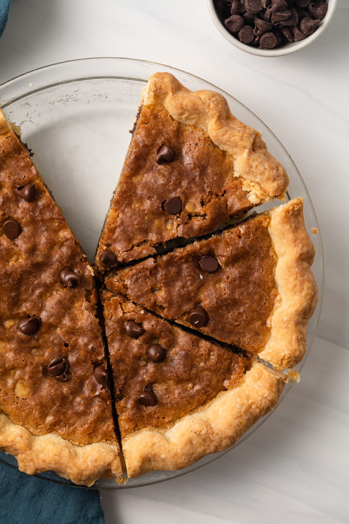 Chocolate chip pie with slices cut.