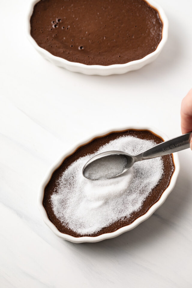 Sugar sprinkled over chocolate custard.