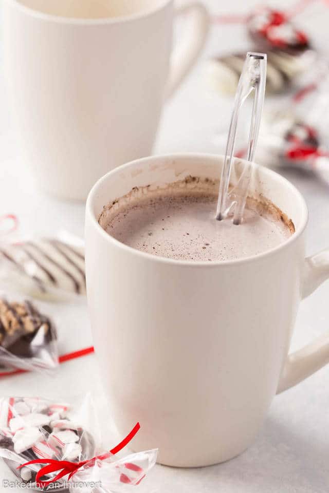 A cream cup full of homemade chocolate espresso with a spoon sticking out.