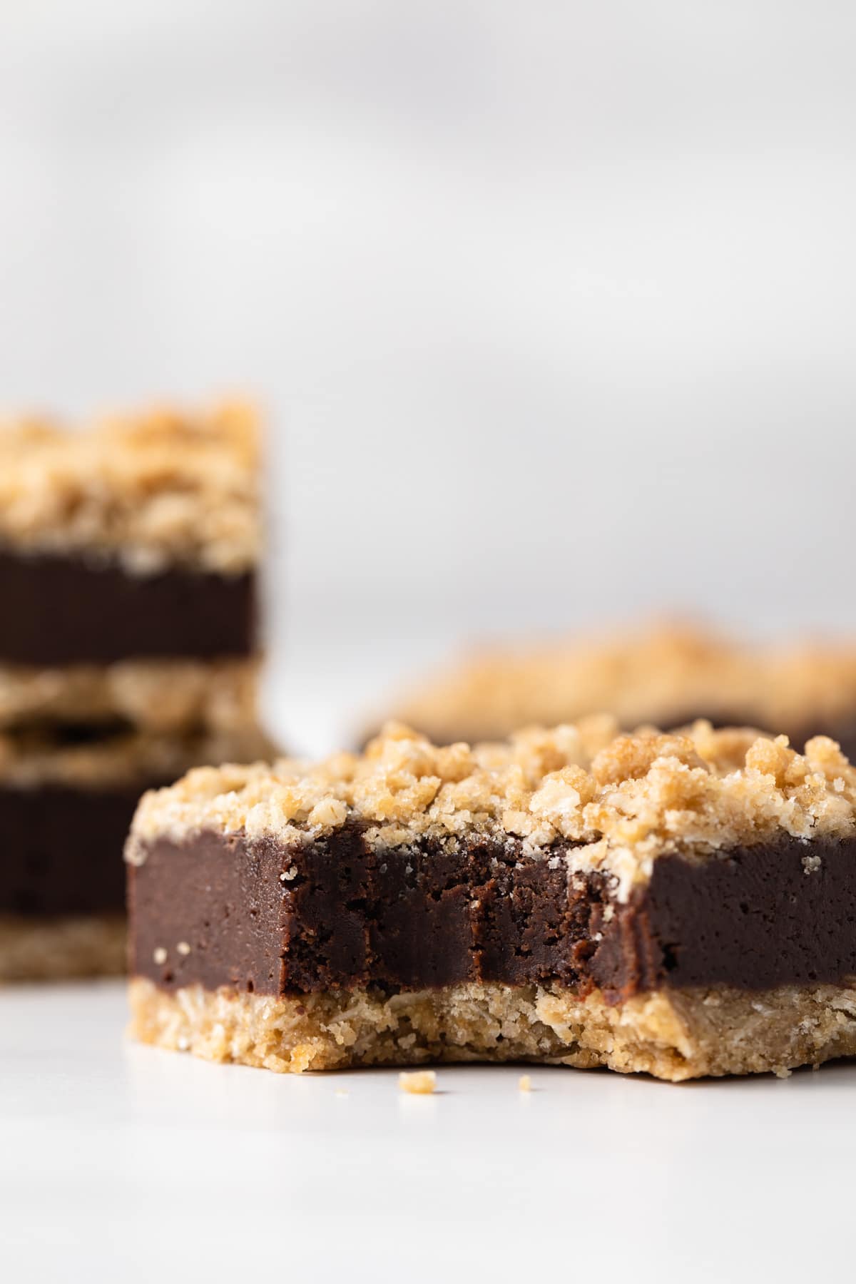 chocolate oat bar with bite taken out so the dense inside is visible