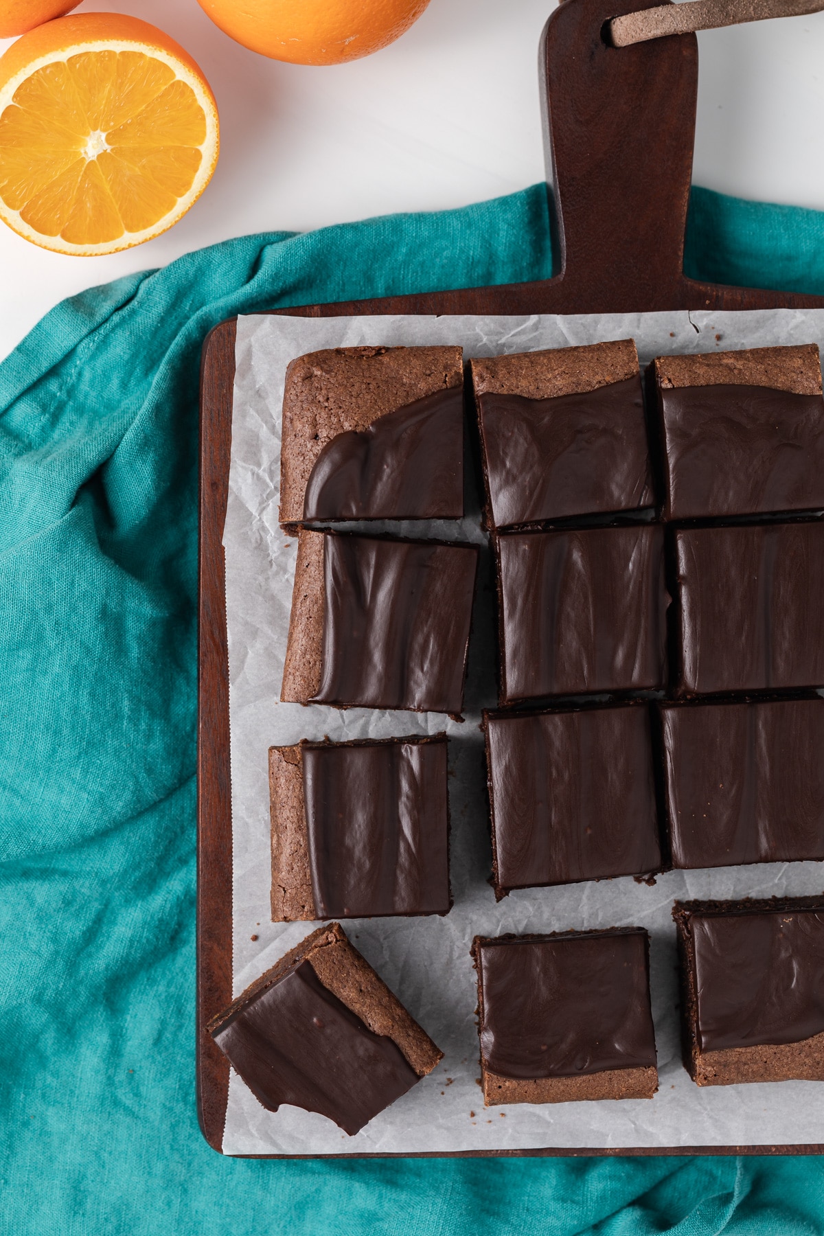 overhead of chocolate orange brownies on wooden serving platter