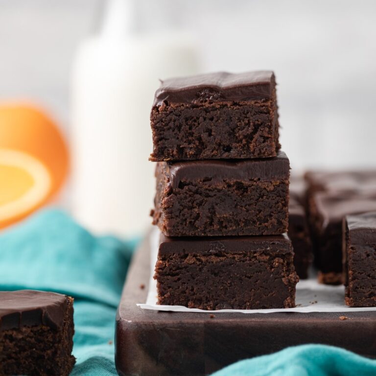 three chocolate orange brownies stacked