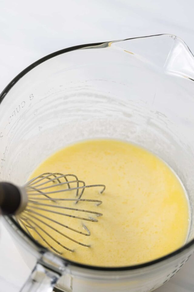 Wet donut ingredients in a glass bowl