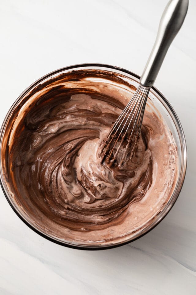 Gooey chocolate mixture in a glass bowl.