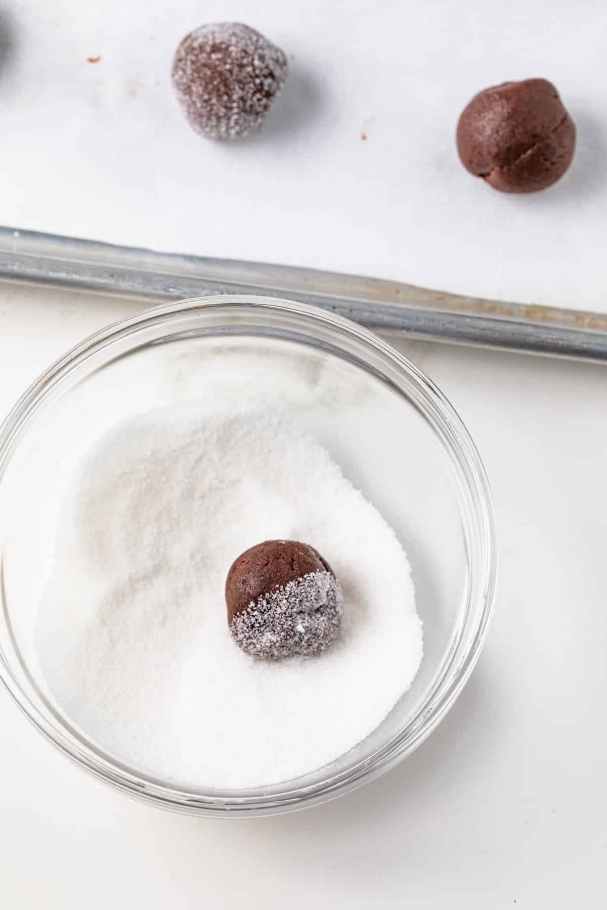 Chocolate cookie balls rolled into sugar.
