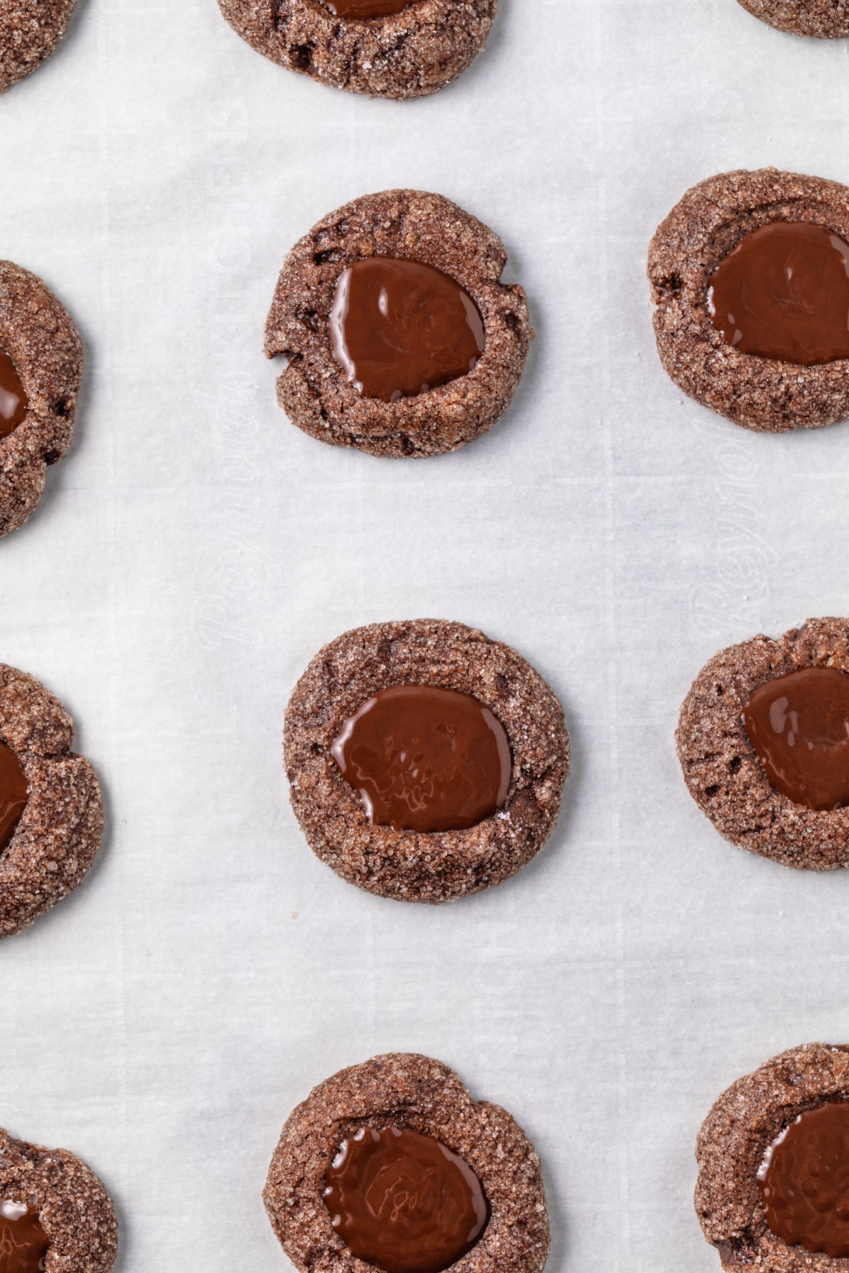 Melted chocolate filling cavity of chocolate cookies.