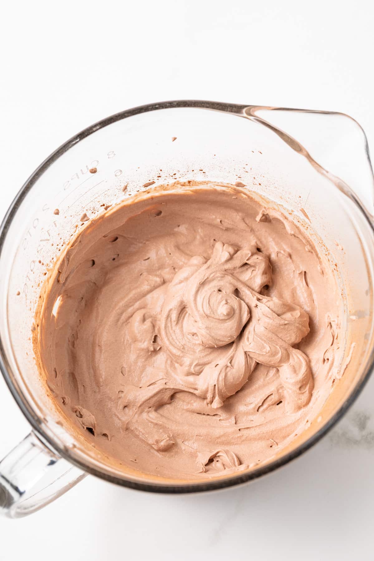 Chocolate whipped cream in a glass bowl.