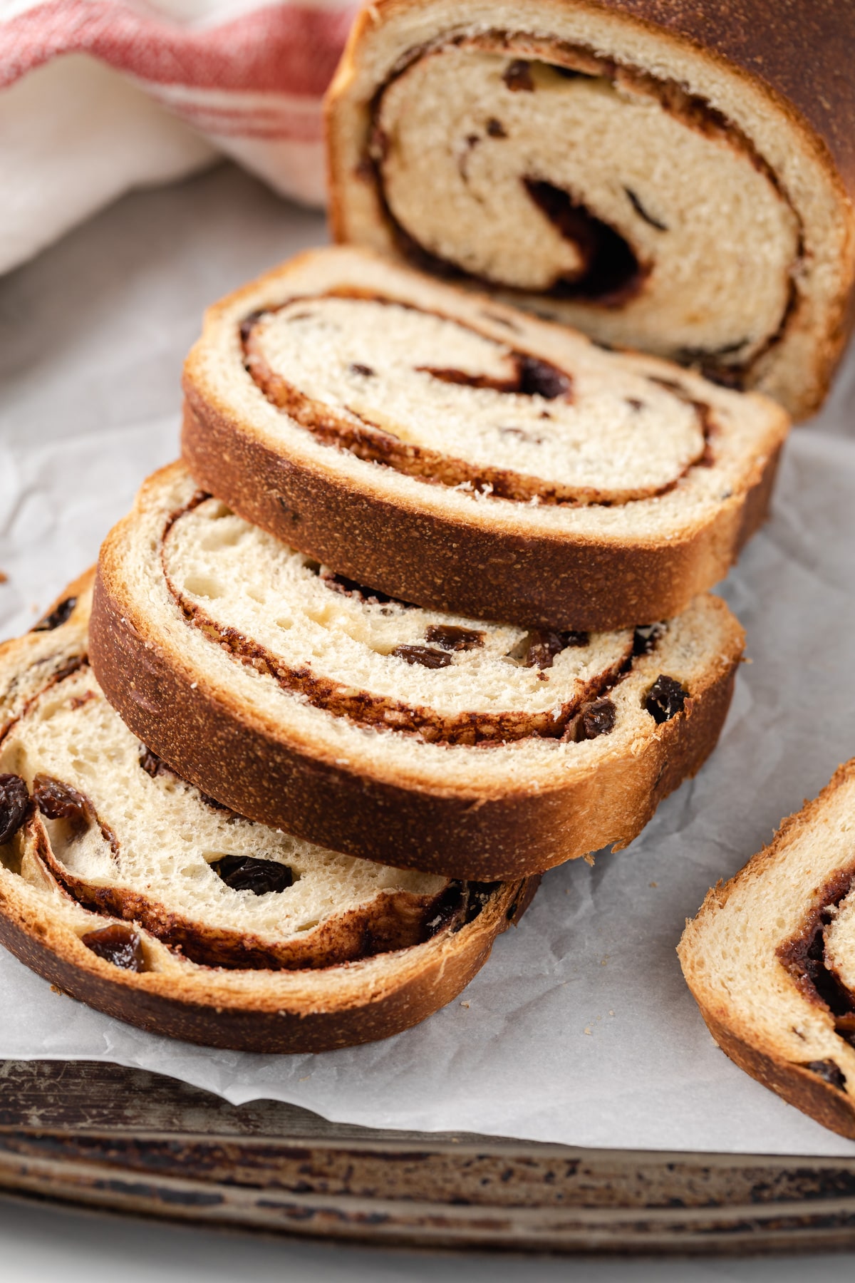 slices of cinnamon raisin bread fallen over off of loaf