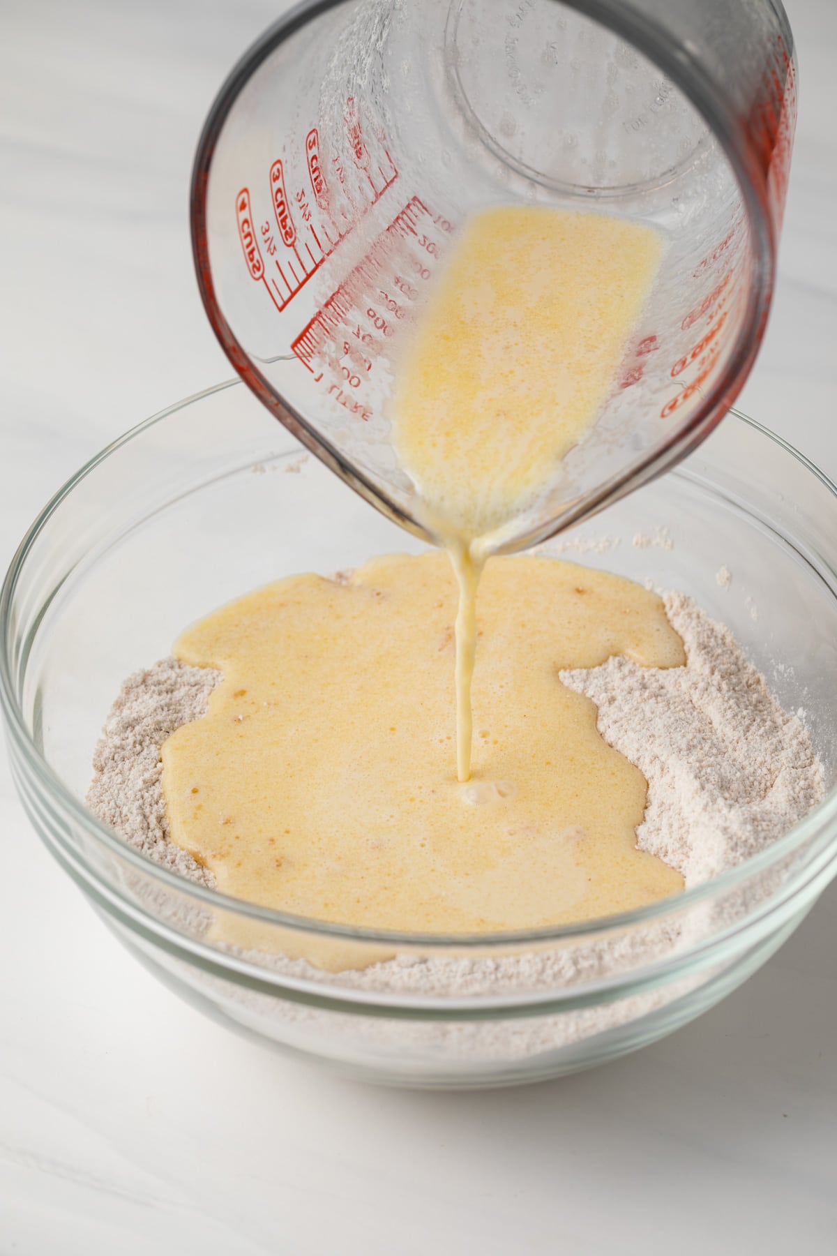 Liquid ingredients poured into dry ingredients.