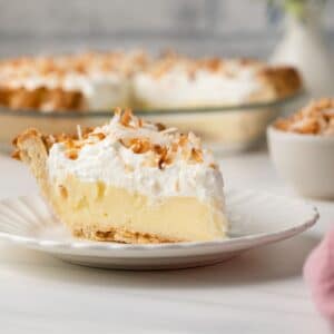 Side view of slice of coconut cream pie.