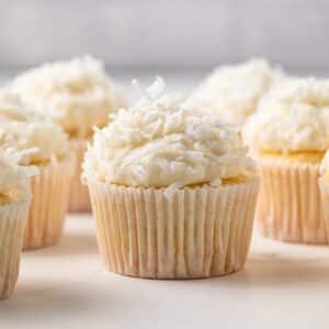 Coconut Cupcakes on a table top.