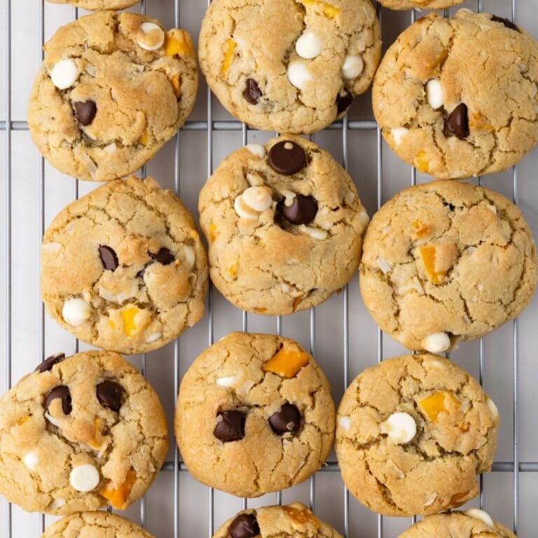 Overhead of Coconut mango chocolate chip cookies on wire rack.