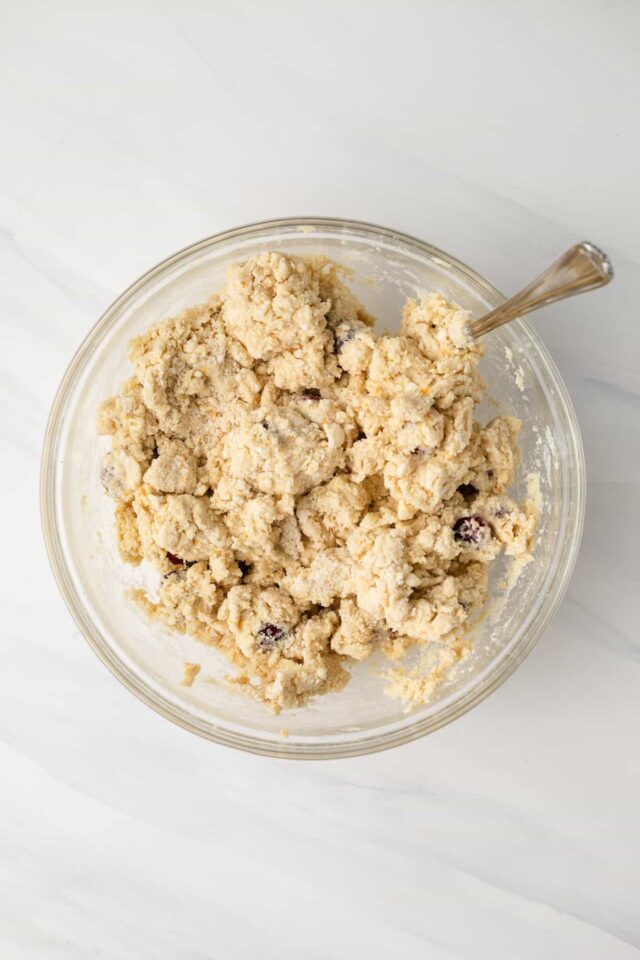 Cranberry orange scone dough in a mixing bowl