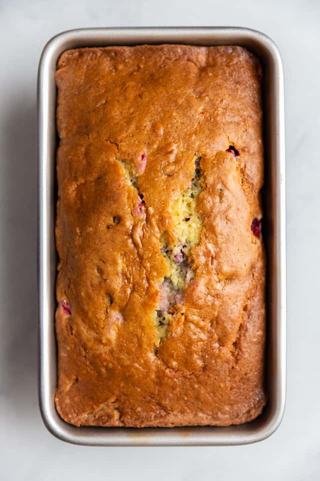 overhead view of cranberry walnut bread in a loaf pan