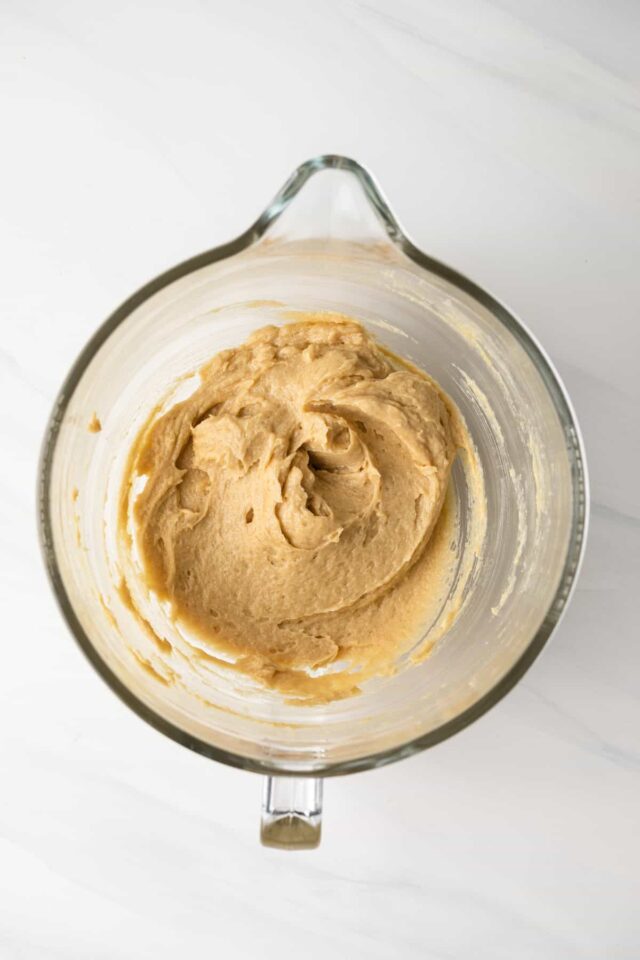 Whipped butters and sugars in a mixing bowl