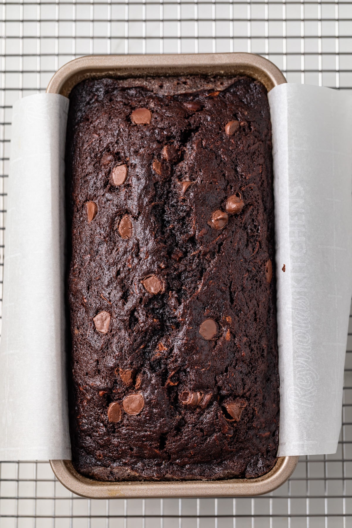 Baked chocolate zucchini bread in a loaf pan.