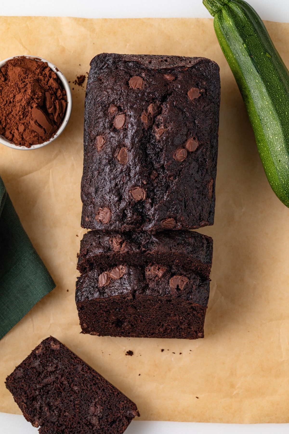 Overhead of sliced loaf of chocolate zucchini bread.