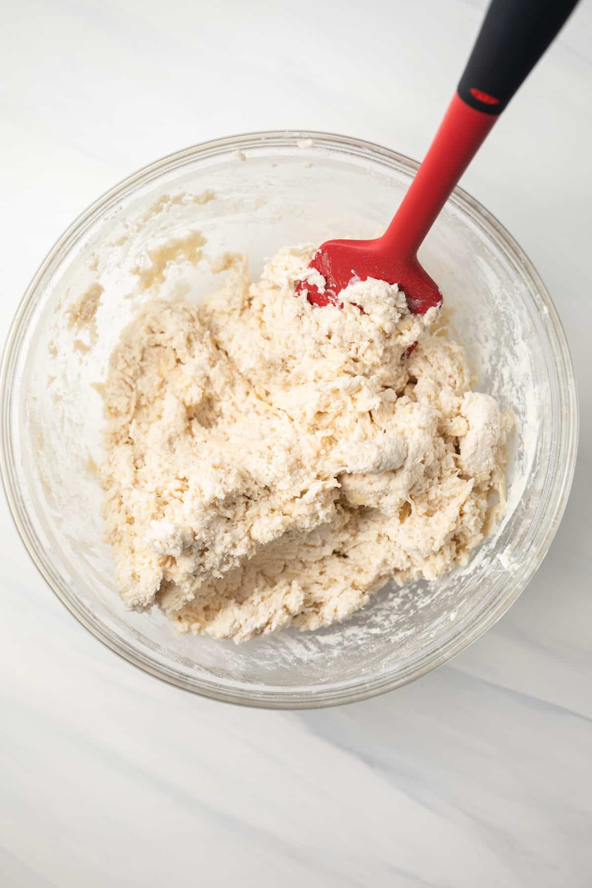 Drop biscuit dough in glass bowl.