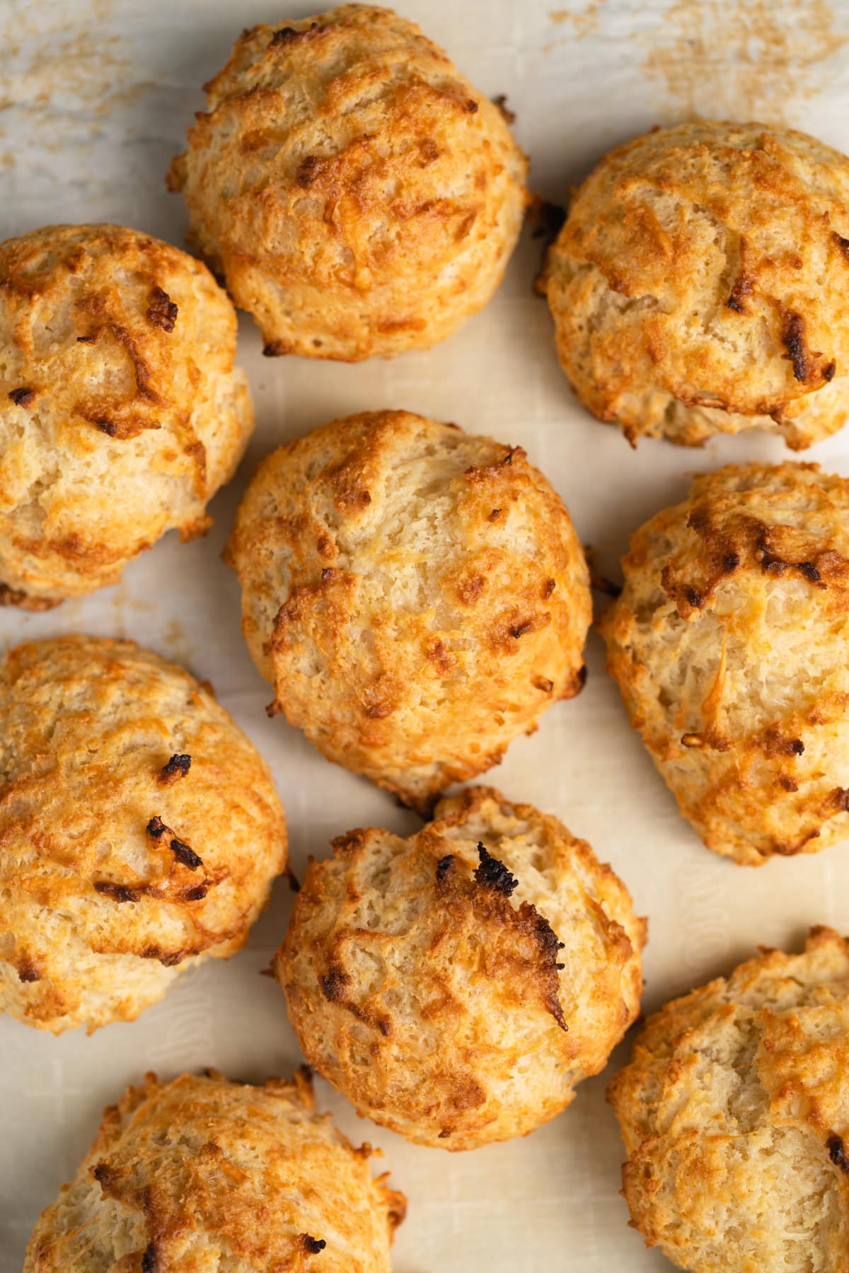 Baked drop biscuits on baking sheet.