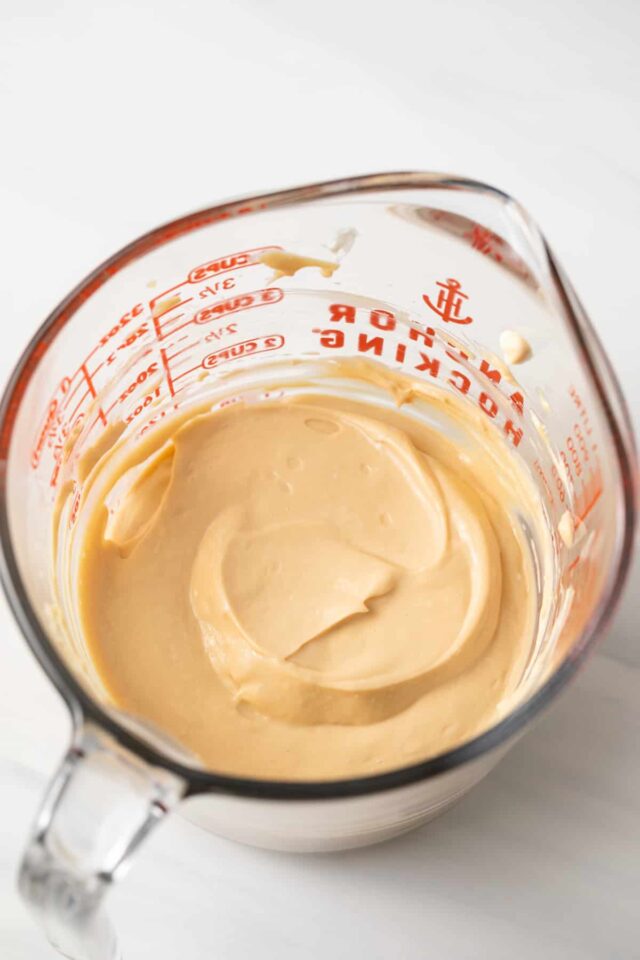 Cheesecake mixture in glass measuring cup