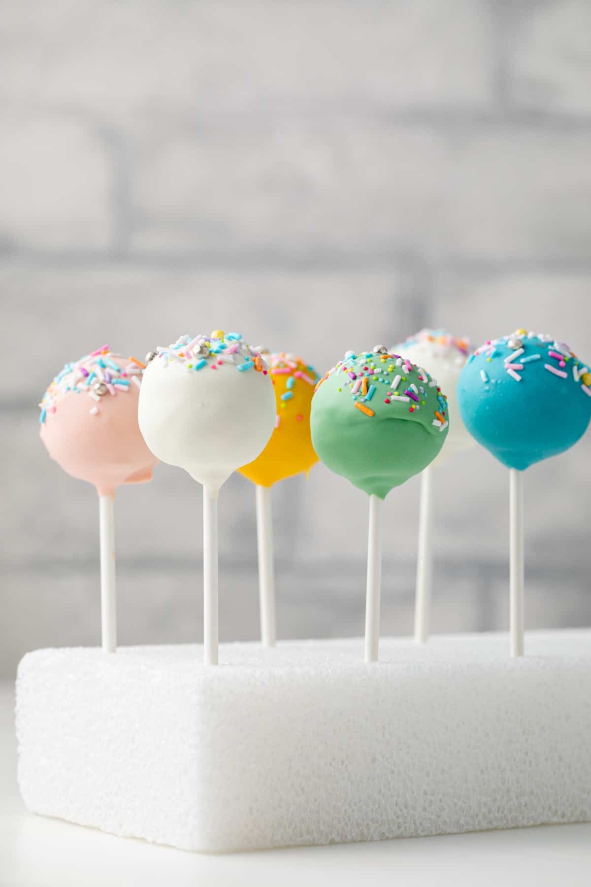 Easter cake pops on a styrofoam block.
