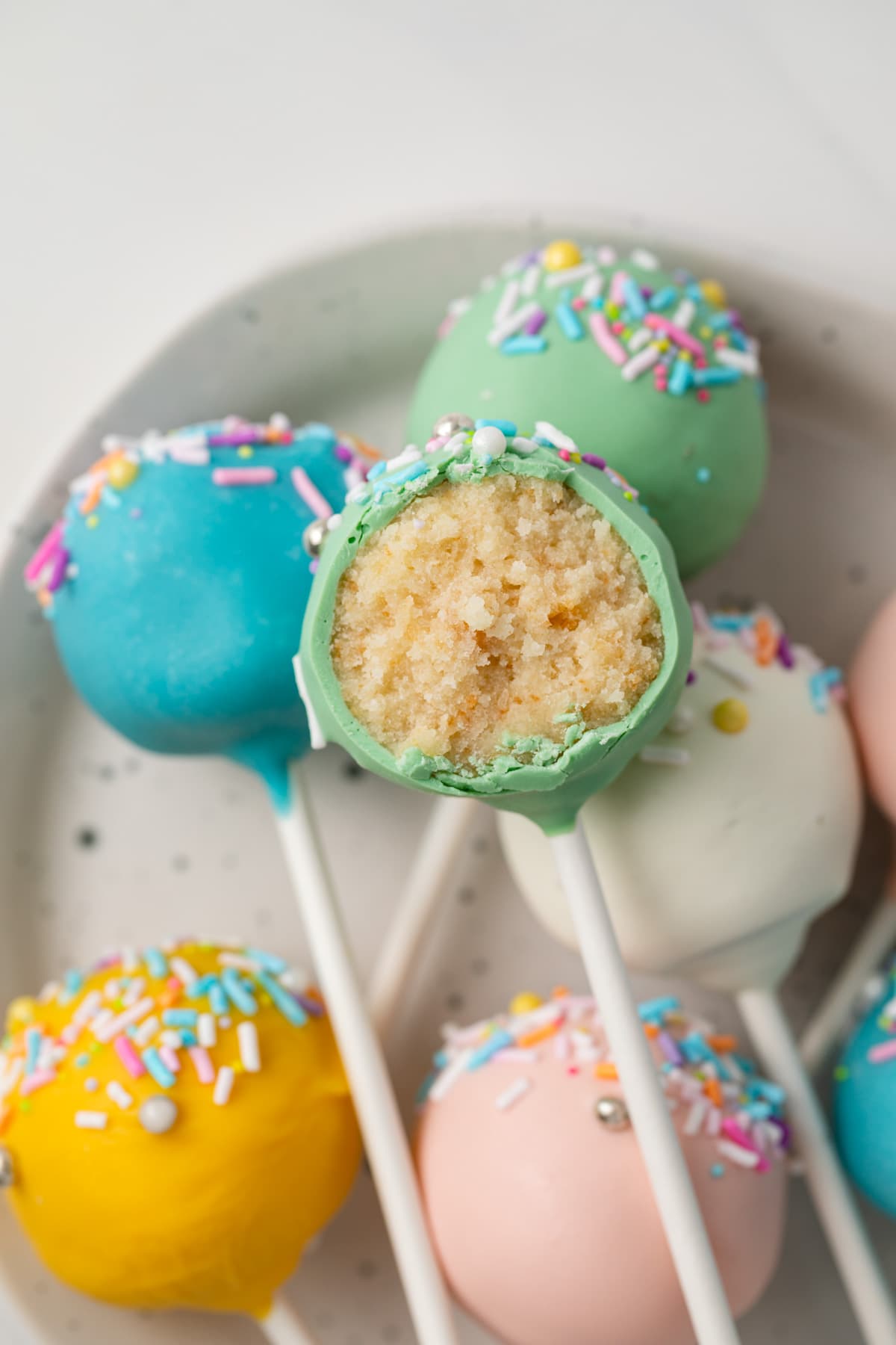 Close up of bite taken out of cake pop.
