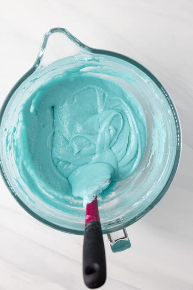 Macaronage in a glass mixing bowl