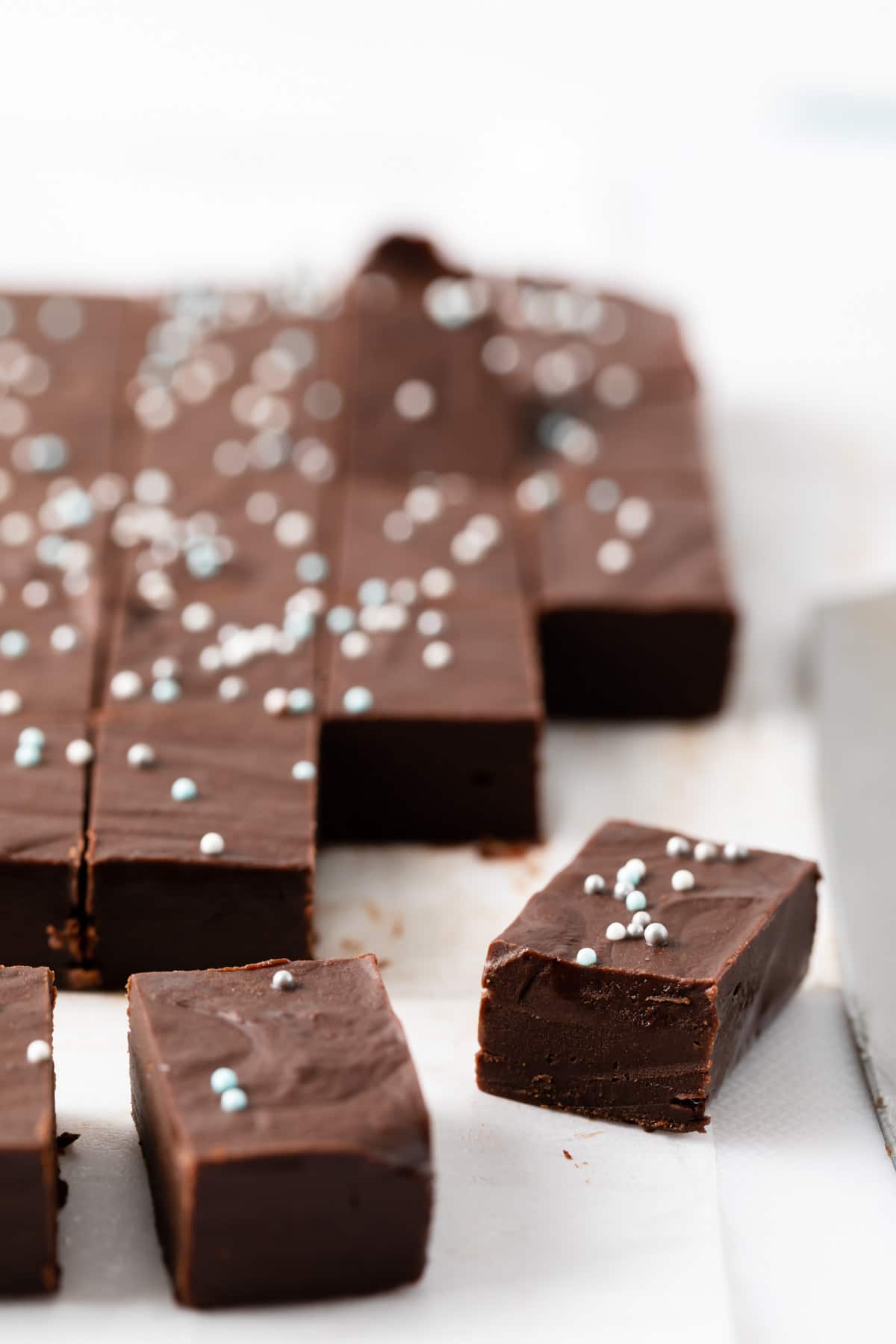 angled view of chocolate fudge with sprinkles on top