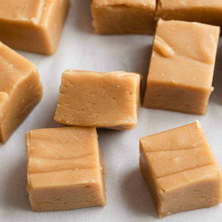 peanut butter fudge scattered on white parchment paper
