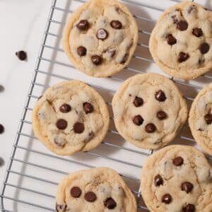 Eggless chocolate chip cookies on a wire rack.