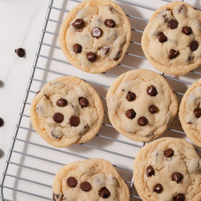 Eggless chocolate chip cookies on a wire rack.