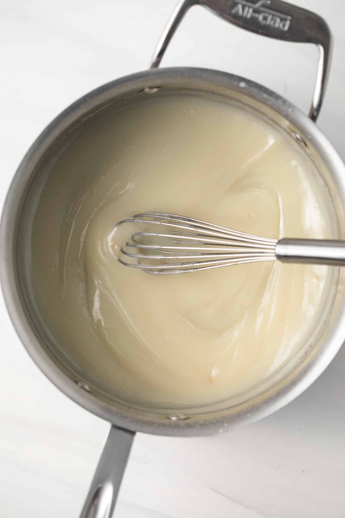 Cooked flour, sugar, and milk in saucepan.