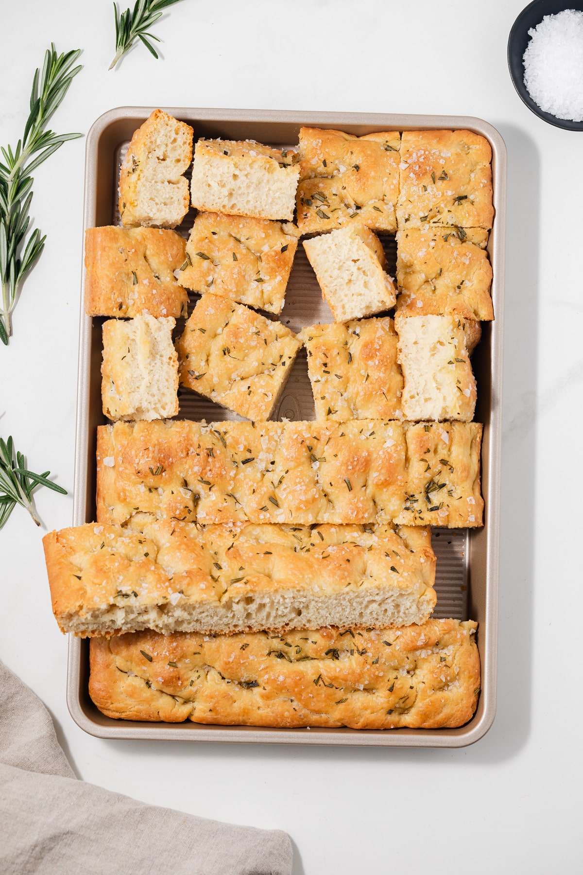 Sliced focaccia in baking pan.