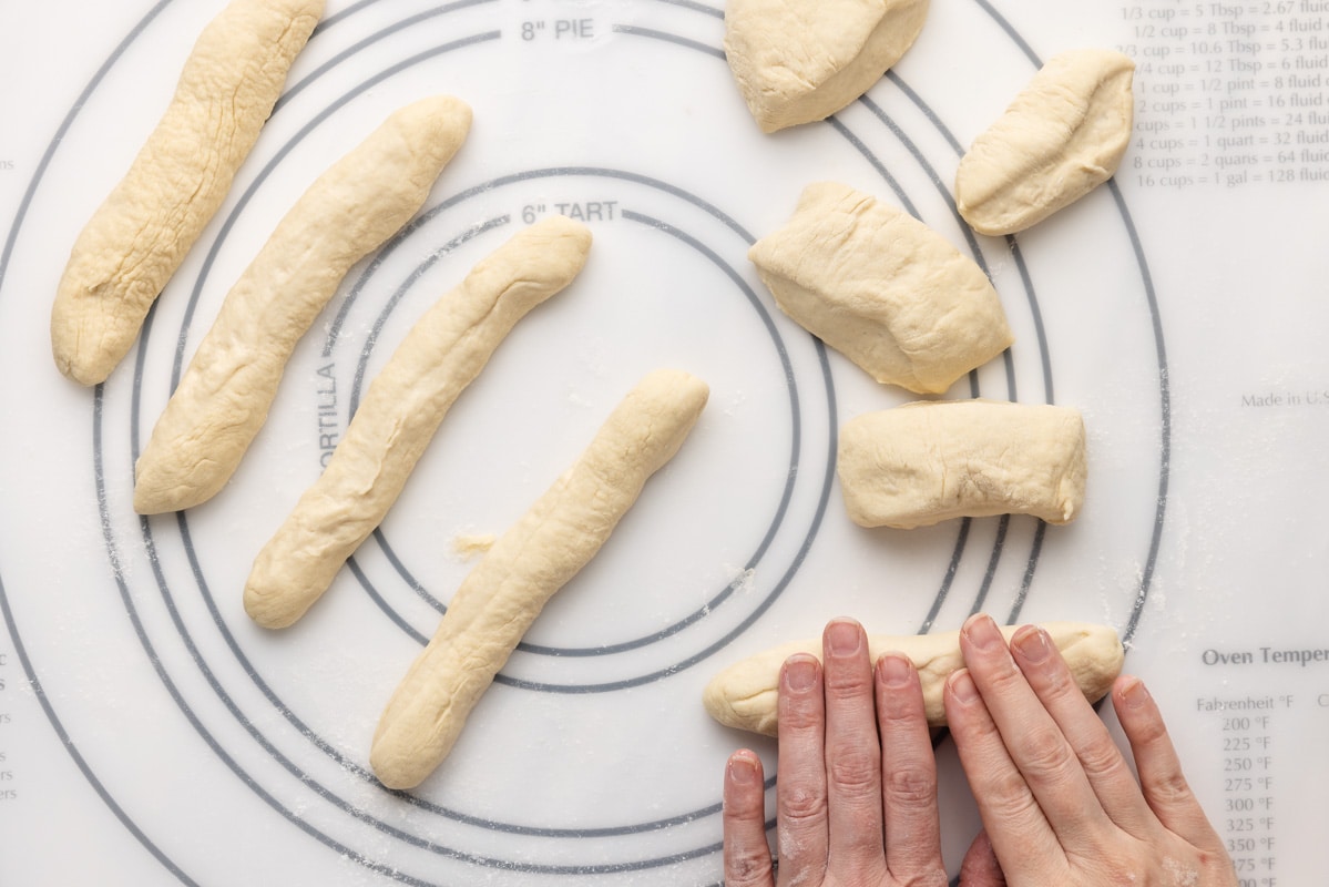 Rolling dough into breadsticks