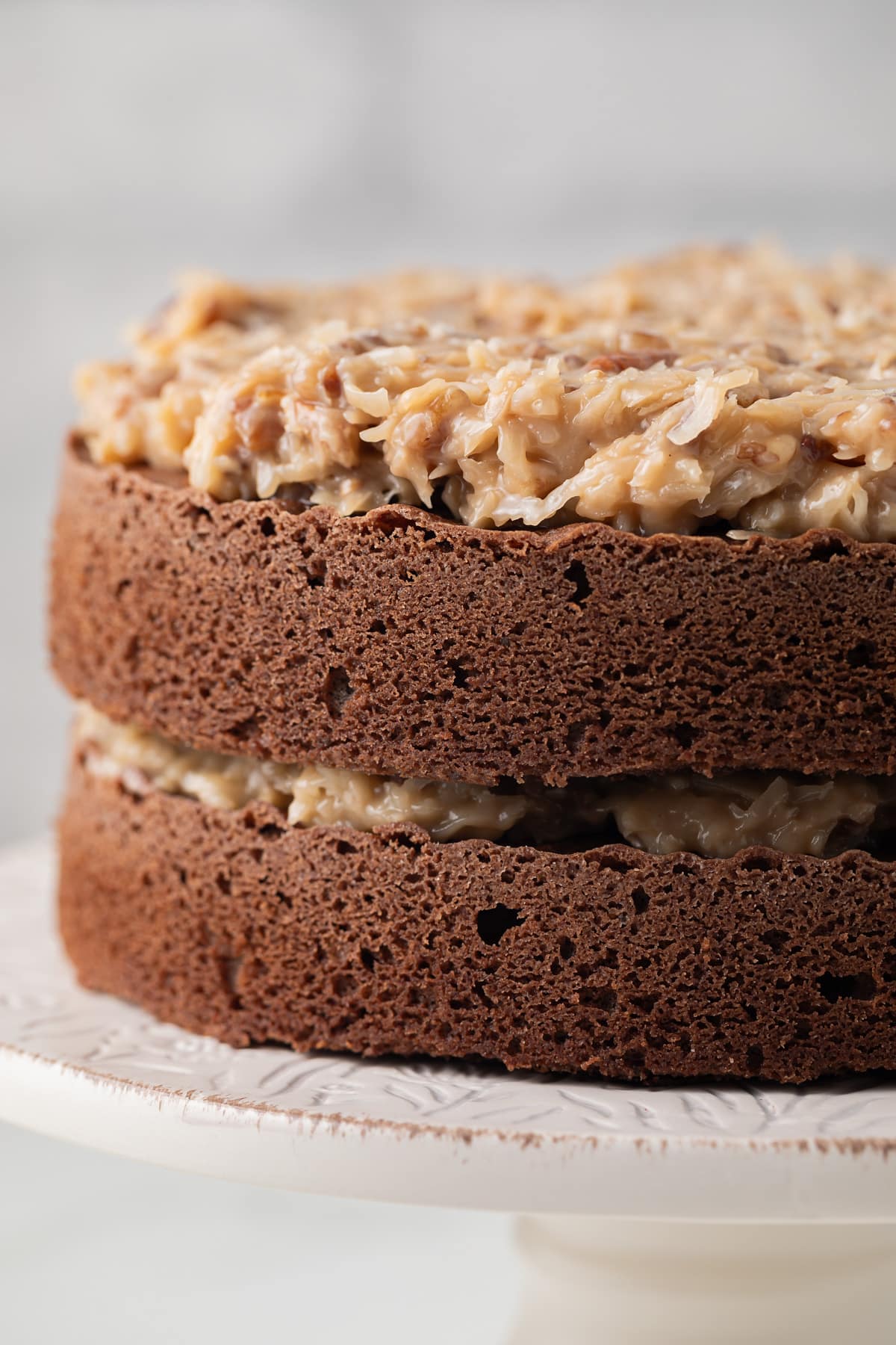 Layers of chocolate cake topped with German chocolate cake frosting.