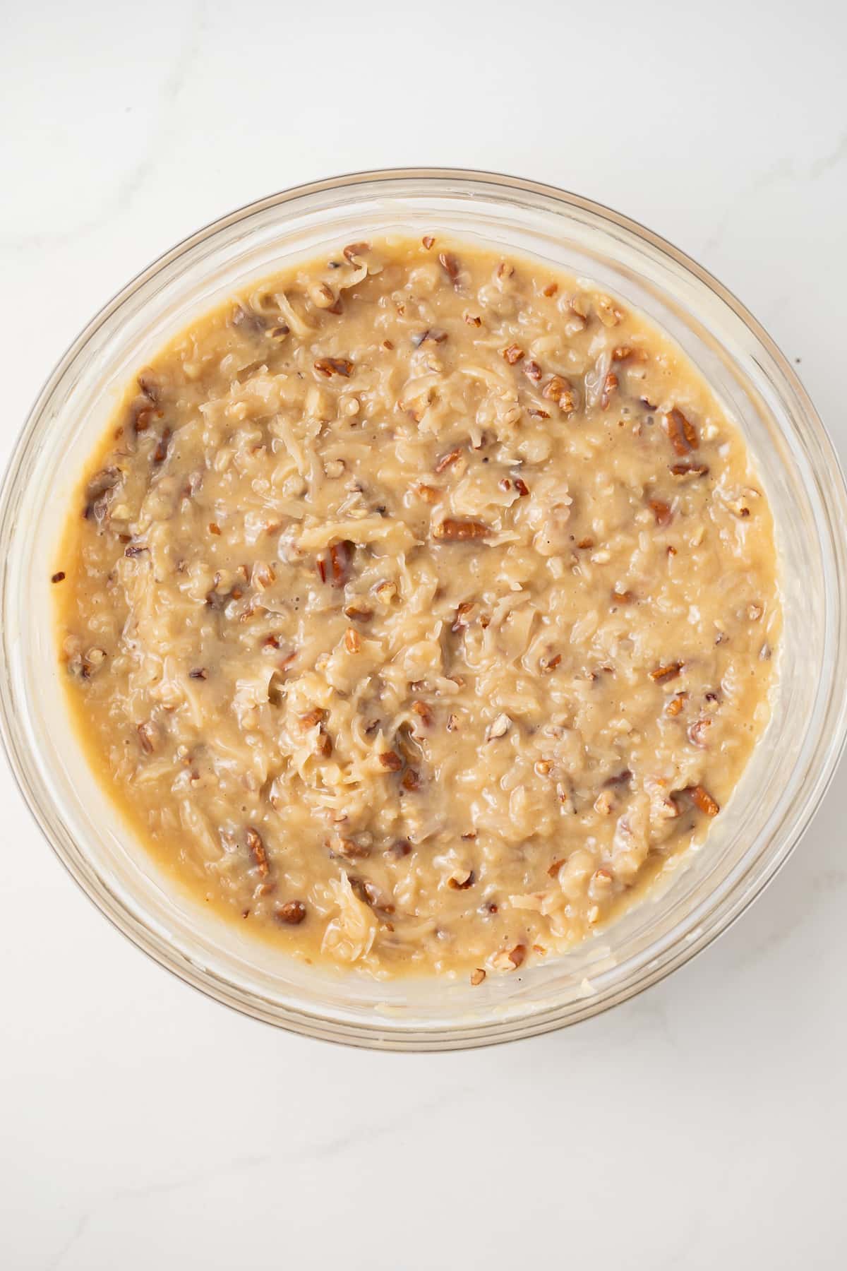 German chocolate cake frosting in glass bowl.