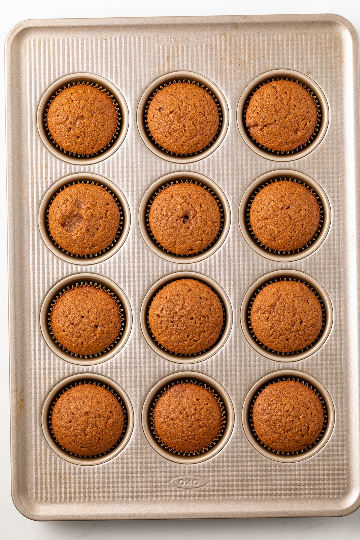 Gingerbread cupcakes in a baking pan.