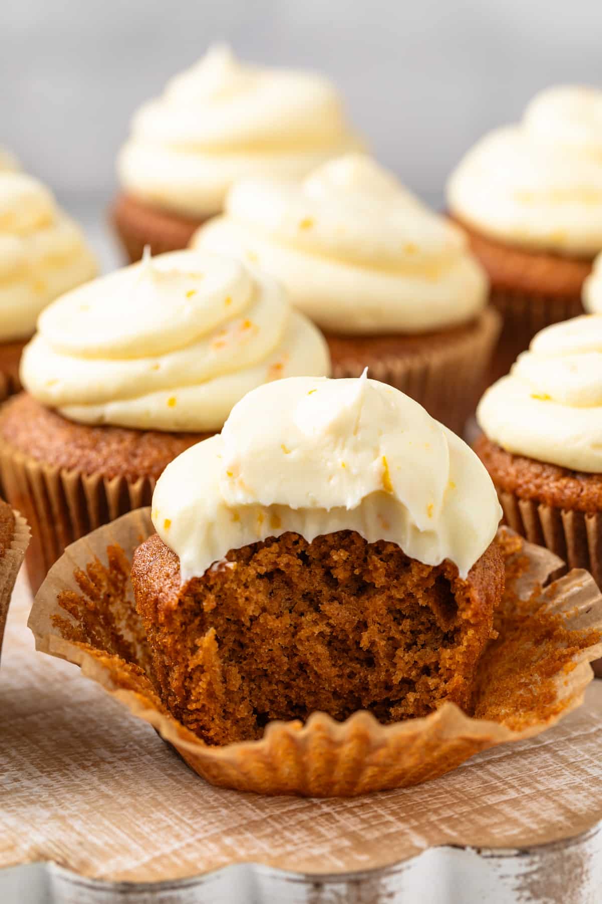 Gingerbread cupcake with a bite taken out.