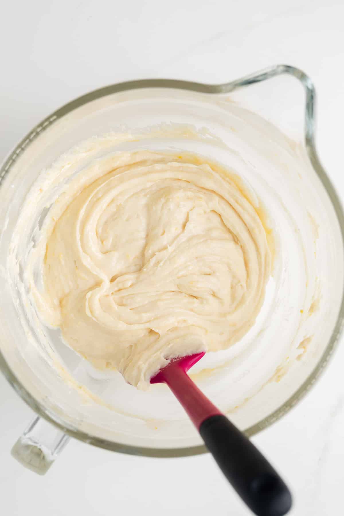 Lemon bread batter in glass bowl.