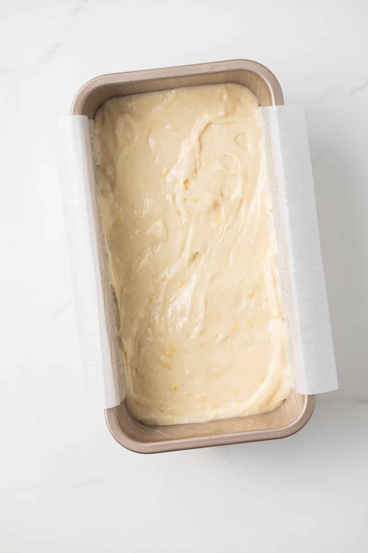 Lemon bread batter in loaf pan.